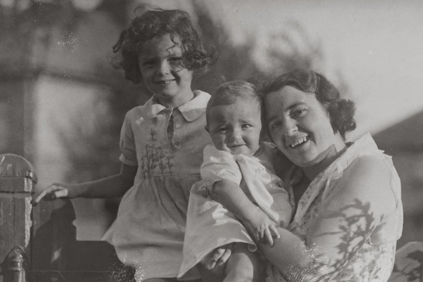 vintage black and white family photo of a mother and two children before the old photo restorer is applied