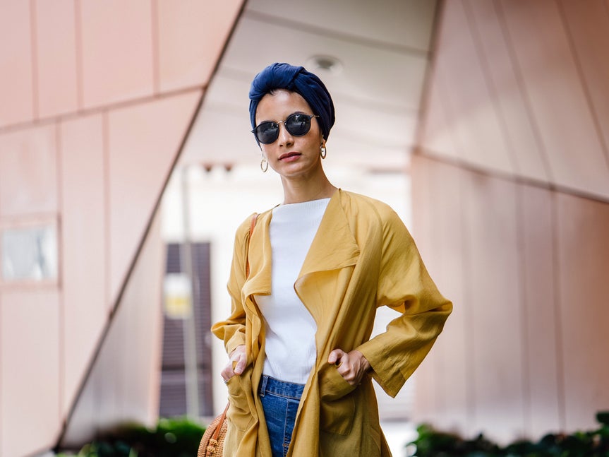 woman in front of angular structure before background removal