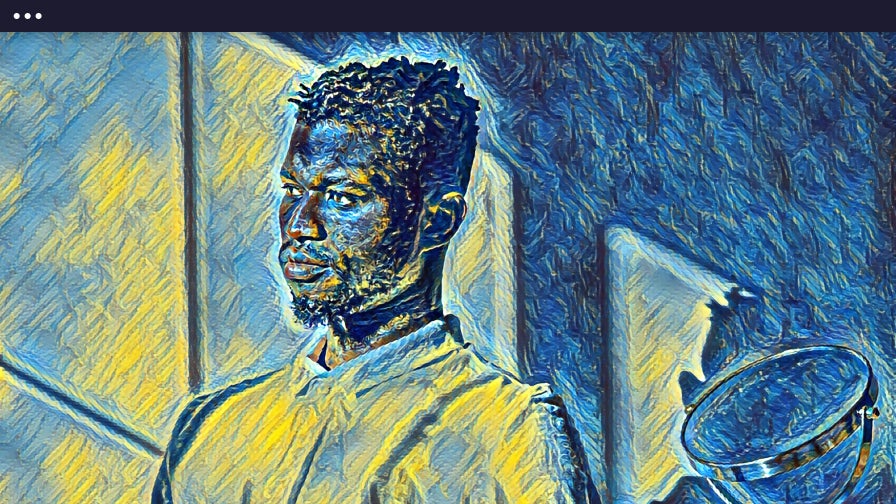 man in front of a window with artistic filter applied