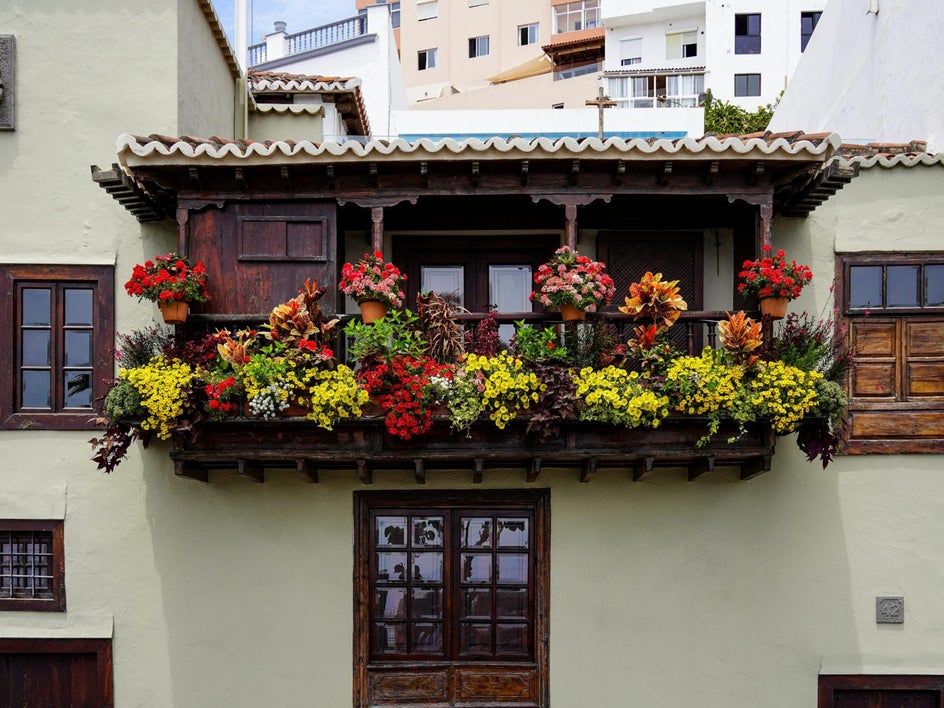 house with flowers on balcony