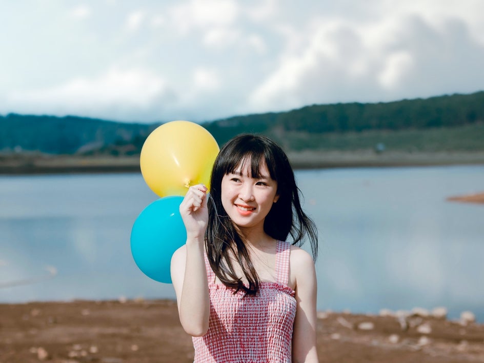 Image of girl with balloons after