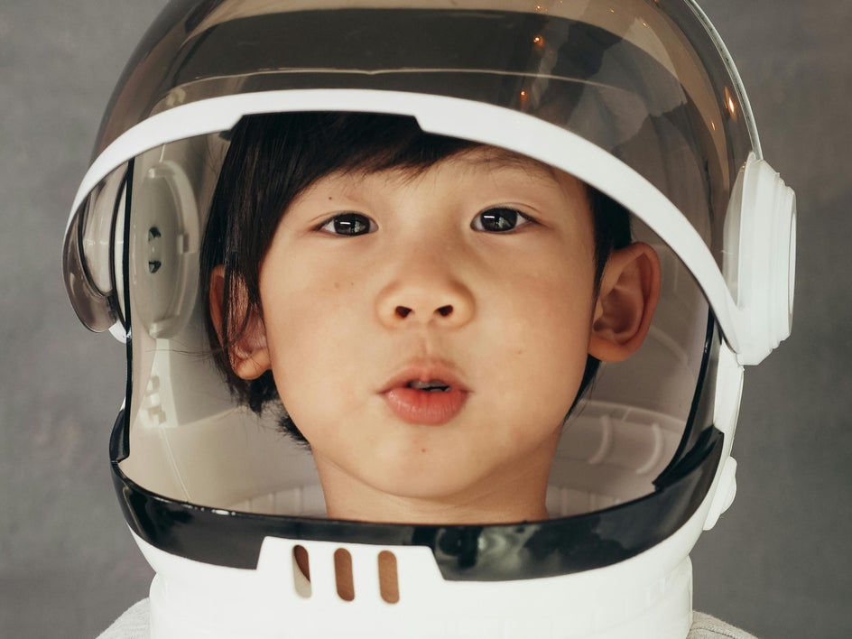 little boy in astronaut costume